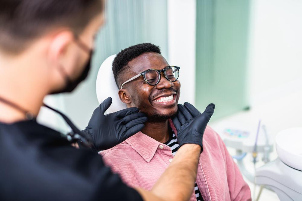 man at the dentist smiling in cary nc