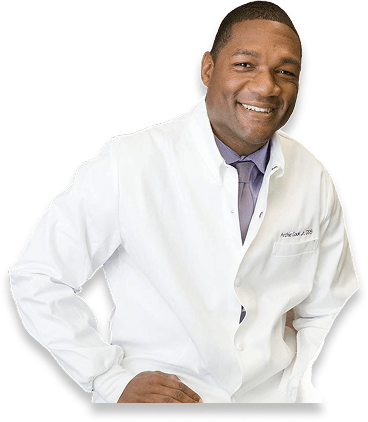 Signature Smiles | Hover Cutout photo of Dr. Archie Cook Jr. DDS smiling in lab coat